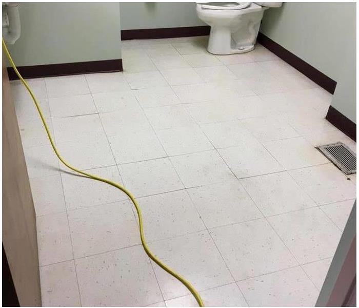 clean white tiles of bathroom floor