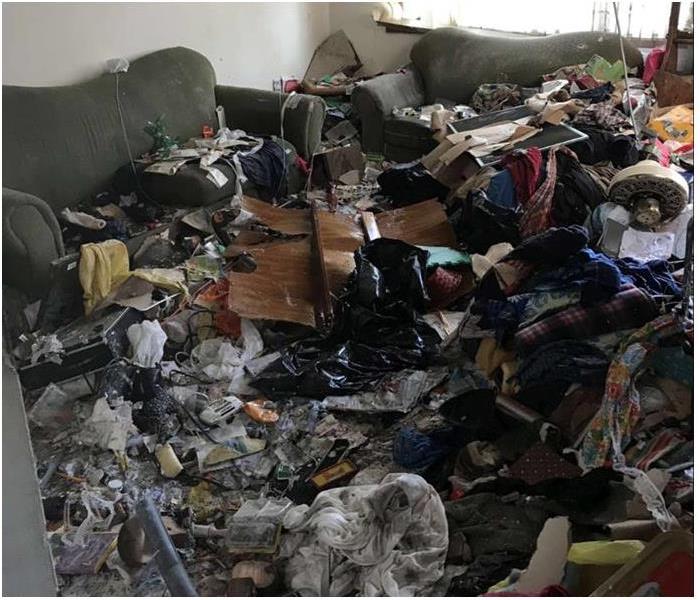 hoarding in a room, debris and items covering everything