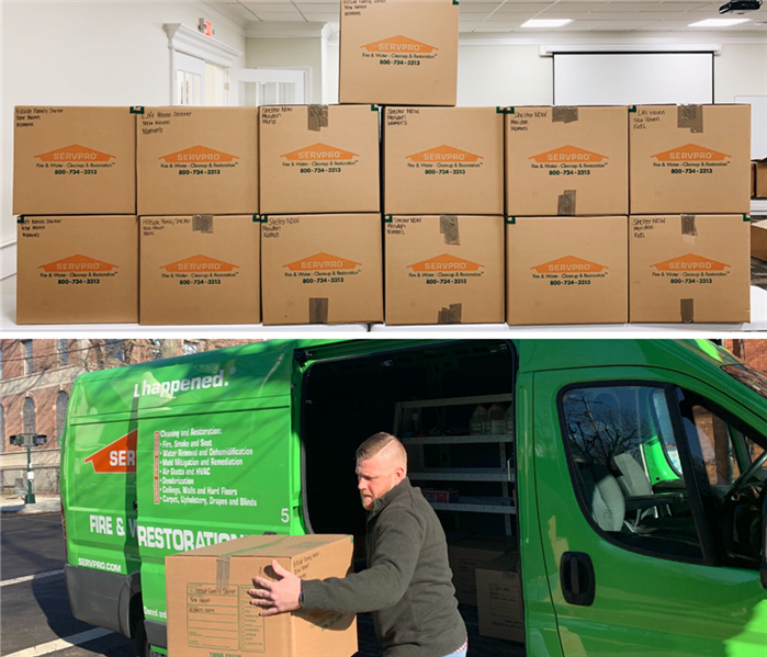 servpro boxes full of donations, and a marketer unloading donations from a servpro van