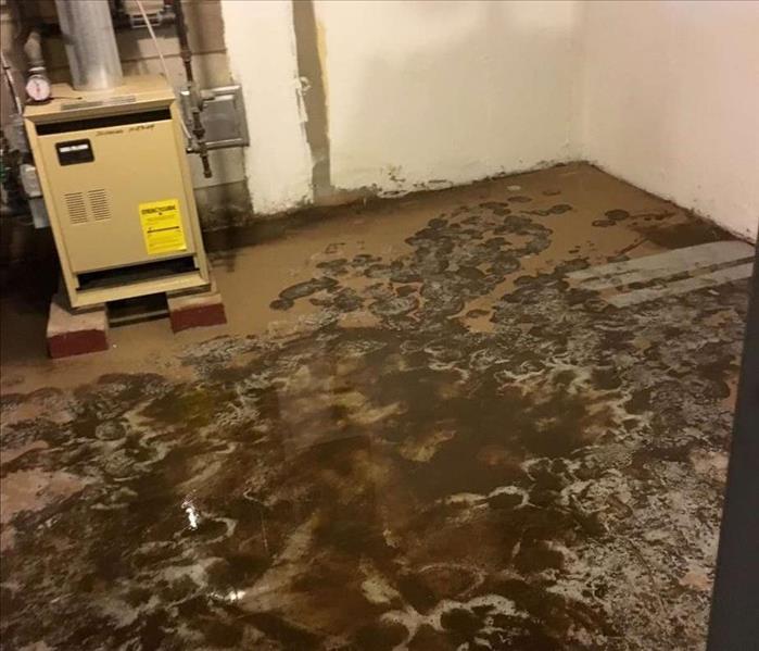 standing water covering floor from burst pipe